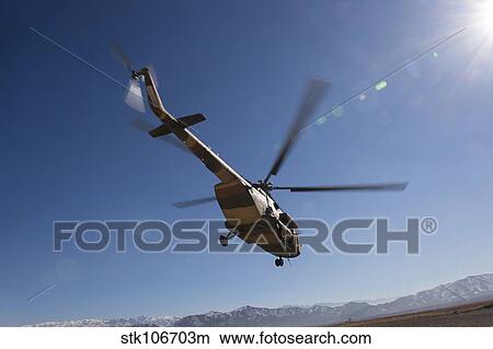 An Afghan Air Force Mil Mi-17 helicopter over Afghanistan. View Large Photo Image Picture - An Afghan Air Force Mil Mi-17 helicopter over Afghanistan.. Fotosearch