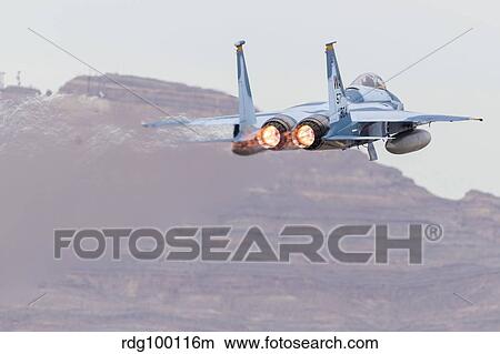An aggressor F-15C Eagle of the U. S. Air Force taking off. View Large Photo Image Picture - An aggressor F-15C Eagle of the U. S. Air Force taking off.. Fotosearch