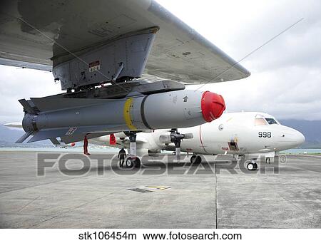 An AGM-65 Maverick tactical missile is mounted on a P-3C Orion. View Large Photo Image Picture - An AGM-65 Maverick tactical missile is mounted on a P-3C Orion.. Fotosearch