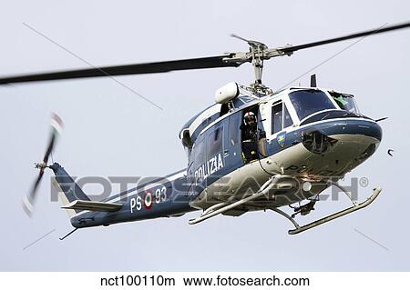 An Agusta Bell 212 of Italy's State Police in flight over Italy. View Large Photo Image Picture - An Agusta Bell 212 of Italy's State Police in flight over Italy.. Fotosearch