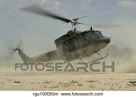 An Agusta Bell AB 212 of the Italian Air Force landing. View Large Photo Image Picture - An Agusta Bell AB 212 of the Italian Air Force landing.. Fotosearch