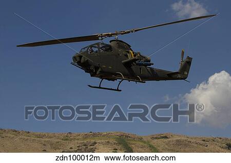 An AH-1F Tzefa of the Israeli Air Force flying over the Golan Heights, Israel. View Large Photo Image Picture - An AH-1F Tzefa of the Israeli Air Force flying over the Golan Heights, Israel.. Fotosearch