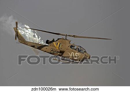 An AH-1S Tzefa of the Israeli Air Force dispenses flares. View Large Photo Image Picture - An AH-1S Tzefa of the Israeli Air Force dispenses flares.. Fotosearch