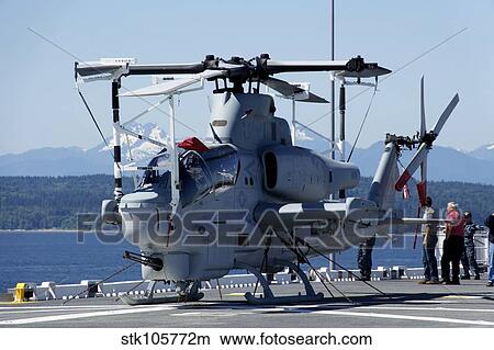 An AH-1W Cobra is chained to the flight deck of USS Bonhomme Richard. View Large Photo Image Picture - An AH-1W Cobra is chained to the flight deck of USS Bonhomme Richard.. Fotosearch