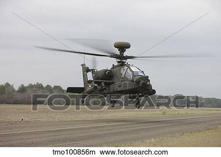 An AH-64 Apache helicopter in midair, Conroe, Texas. View Large Photo Image Picture - An AH-64 Apache helicopter in midair, Conroe, Texas.. Fotosearch