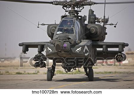 An AH-64 Apache helicopter returns from a mission over Iraq. View Large Photo Image Picture - An AH-64 Apache helicopter returns from a mission over Iraq.. Fotosearch