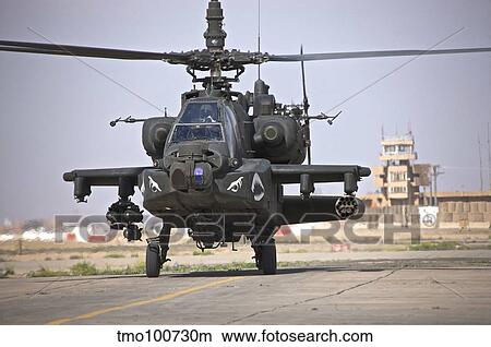 An AH-64 Apache helicopter returns from a mission over Iraq. View Large Photo Image Picture - An AH-64 Apache helicopter returns from a mission over Iraq.. Fotosearch