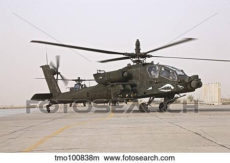 An AH-64 Apache helicopter taxiing on the flight line. View Large Photo Image Picture - An AH-64 Apache helicopter taxiing on the flight line.. Fotosearch