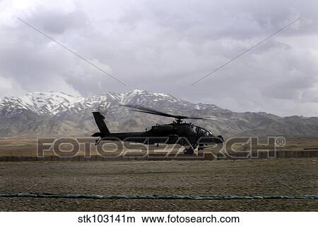 An AH-64A Apache taking off from Forward Operating Base Gardez in Afghanistan. View Large Photo Image Picture - An AH-64A Apache taking off from Forward Operating Base Gardez in Afghanistan.. Fotosearch