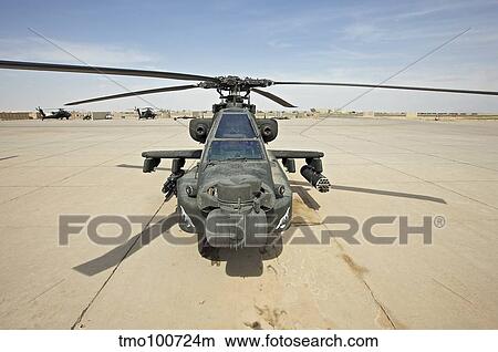 An AH-64D Apache helicopter at COB Speicher, Tikrit, Iraq. View Large Photo Image Picture - An AH-64D Apache helicopter at COB Speicher, Tikrit, Iraq.. Fotosearch
