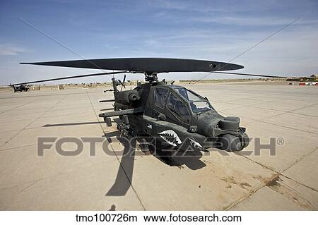 An AH-64D Apache helicopter at COB Speicher, Tikrit, Iraq. View Large Photo Image Picture - An AH-64D Apache helicopter at COB Speicher, Tikrit, Iraq.. Fotosearch