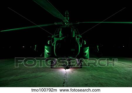 An AH-64D Apache helicopter at night. View Large Photo Image Picture - An AH-64D Apache helicopter at night.. Fotosearch