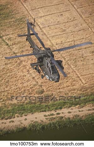 An AH-64D Apache helicopter in flight over Northern Iraq. View Large Photo Image Picture - An AH-64D Apache helicopter in flight over Northern Iraq.. Fotosearch