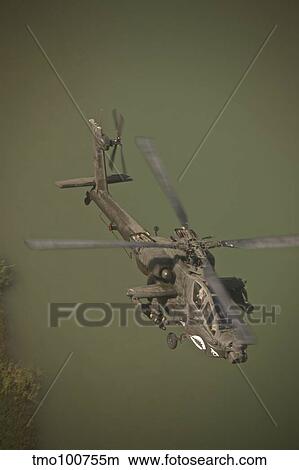 An AH-64D Apache helicopter in flight over Northern Iraq. View Large Photo Image Picture - An AH-64D Apache helicopter in flight over Northern Iraq.. Fotosearch
