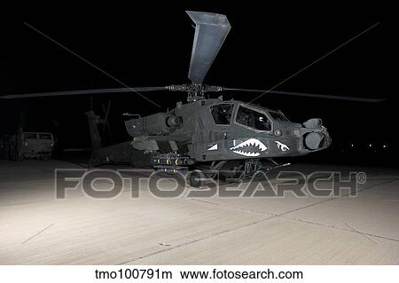 An AH-64D Apache Longbow at night, Tikrit, Iraq. View Large Photo Image Picture - An AH-64D Apache Longbow at night, Tikrit, Iraq.. Fotosearch