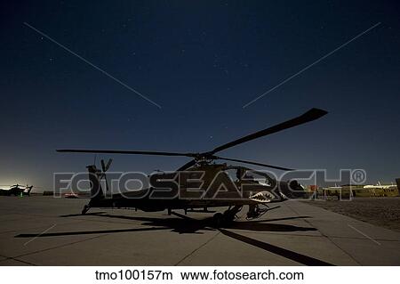 An AH-64D Apache Longbow Block III on the flight line at night. View Large Photo Image Picture - An AH-64D Apache Longbow Block III on the flight line at night.. Fotosearch