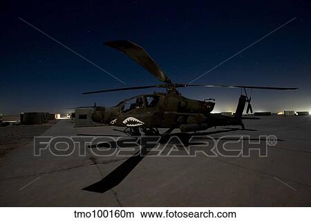 An AH-64D Apache Longbow Block III on the flight line at night. View Large Photo Image Picture - An AH-64D Apache Longbow Block III on the flight line at night.. Fotosearch
