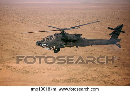 An AH-64D Apache Longbow fires a hydra rocket over northern Iraq. View Large Photo Image Picture - An AH-64D Apache Longbow fires a hydra rocket over northern Iraq.. Fotosearch