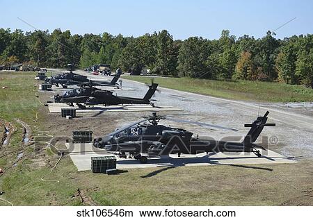 An air crew starts their AH-64D Apache helicopters at Fort Campbell. View Large Photo Image Picture - An air crew starts their AH-64D Apache helicopters at Fort Campbell.. Fotosearch