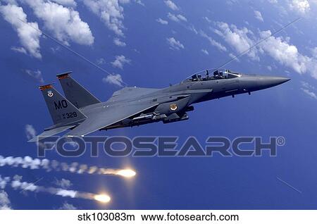 An Air Force F-15E Strike Eagle fires flares during an aerial training dog fight off the coast of Guam. View Large Photo Image Picture - An Air Force F-15E Strike Eagle fires flares during an aerial training dog fight off the coast of Guam. . Fotosearch