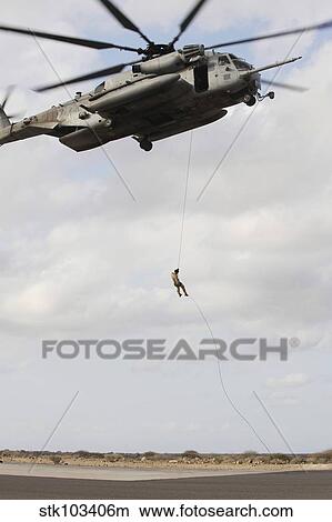 An Air Force pararescueman conducts a combat insertion and extraction exercise in Djibouti, Africa. View Large Photo Image Picture - An Air Force pararescueman conducts a combat insertion and extraction exercise in Djibouti, Africa.. Fotosearch