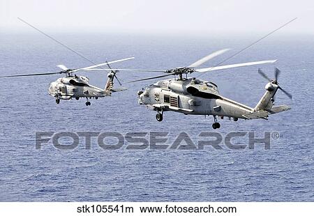 An airborne change of command in the sky over the South China Sea. View Large Photo Image Picture - An airborne change of command in the sky over the South China Sea.. Fotosearch