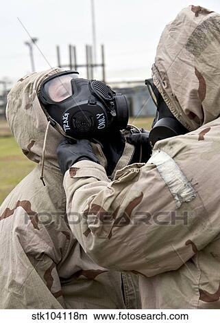 An Airman assists his wingman during an operational readiness exercise. View Large Photo Image Picture - An Airman assists his wingman during an operational readiness exercise.. Fotosearch