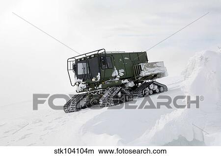 Picture - An all-terrain vehicle gets stuck on the Calispell Mountain Peak in Cusick, Washington.. Fotosearch