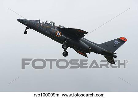 An Alpha Jet of the French Air Force in flight over the Netherlands. View Large Photo Image Picture - An Alpha Jet of the French Air Force in flight over the Netherlands.. Fotosearch