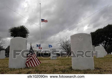 An American flag flies at half staff. View Large Photo Image Picture - An American flag flies at half staff.. Fotosearch