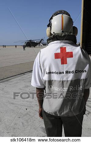 An American Red Cross volunteer waits to board an MH-53E Sea Dragon. View Large Photo Image Picture - An American Red Cross volunteer waits to board an MH-53E Sea Dragon.. Fotosearch