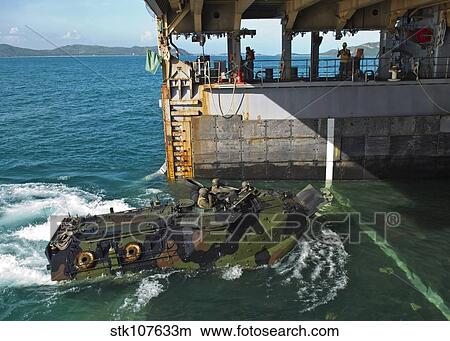 An amphibious assault vehicle enters the well deck of USS Tortuga. View Large Photo Image Picture - An amphibious assault vehicle enters the well deck of USS Tortuga.. Fotosearch