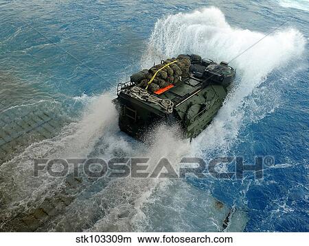 An amphibious assault vehicle exits the well deck of USS Fort McHenry. View Large Photo Image Picture - An amphibious assault vehicle exits the well deck of USS Fort McHenry.. Fotosearch