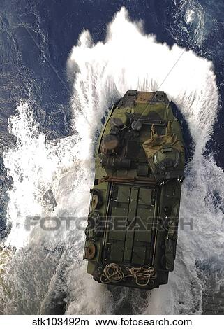 An amphibious assault vehicle exits the well deck of USS Essex. View Large Photo Image Picture - An amphibious assault vehicle exits the well deck of USS Essex.. Fotosearch