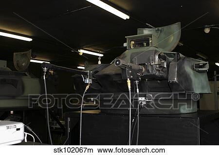 An amphibious assault vehicle turret trainer sits in an old armory building. View Large Photo Image Picture - An amphibious assault vehicle turret trainer sits in an old armory building.. Fotosearch