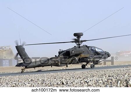 An Apache helicopter prepares for takeoff at Camp Bastion, Afghanistan. View Large Photo Image Picture - An Apache helicopter prepares for takeoff at Camp Bastion, Afghanistan.. Fotosearch