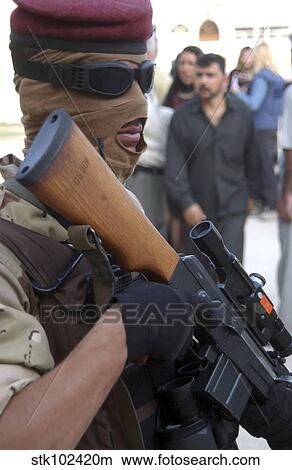 An armed Iraqi Army guard provides security. View Large Photo Image Picture - An armed Iraqi Army guard provides security.. Fotosearch
