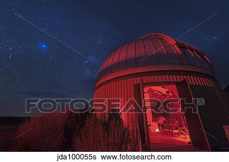 An astronomer peers through a telescope at the Orion region of the sky. View Large Photo Image Stock Photograph - An astronomer peers through a telescope at the Orion region of the sky.. Fotosearch