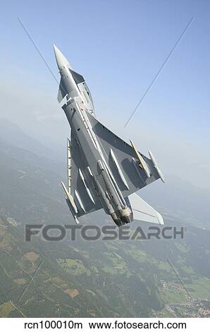 An Austrian Air Force EF2000 Typhoon over the Austrian Alps. View Large Photo Image Picture - An Austrian Air Force EF2000 Typhoon over the Austrian Alps.. Fotosearch