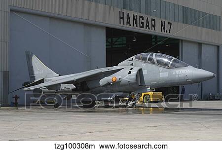 An AV-8B Harrier II of the Spanish Navy parked in front of the hangar bay. View Large Photo Image Picture - An AV-8B Harrier II of the Spanish Navy parked in front of the hangar bay.. Fotosearch