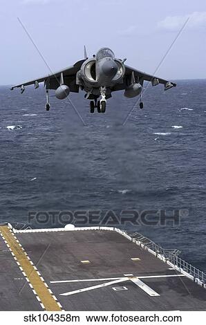 Picture - An AV-8B Harrier II prepares to land on the flight deck of USS Nassau.. Fotosearch