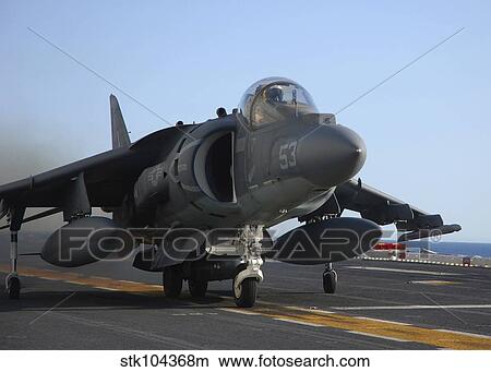 Picture - An AV-8B Harrier launches from the flight deck of USS Peleliu.. Fotosearch
