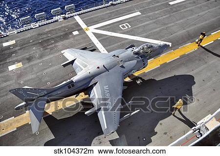 An AV-8B Harrier prepares to takeoff from USS Peleliu. View Large Photo Image Picture - An AV-8B Harrier prepares to takeoff from USS Peleliu.. Fotosearch