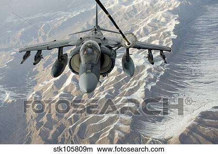 An A/V-8B Harrier receives fuel over Afghanistan from a KC-10 Extender. View Large Photo Image Picture - An A/V-8B Harrier receives fuel over Afghanistan from a KC-10 Extender.. Fotosearch