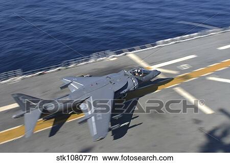 An AV-8B Harrier takes off from the flight deck of USS Bataan. View Large Photo Image Picture - An AV-8B Harrier takes off from the flight deck of USS Bataan.. Fotosearch