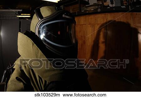 An Aviation Ordnanceman wears a heavy protective bomb suit during training. View Large Photo Image Picture - An Aviation Ordnanceman wears a heavy protective bomb suit during training.. Fotosearch