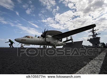 An E-2C Hawkeye aircraft prepares to launch from the flight deck of USS Carl Vinson. View Large Photo Image Picture - An E-2C Hawkeye aircraft prepares to launch from the flight deck of USS Carl Vinson.. Fotosearch