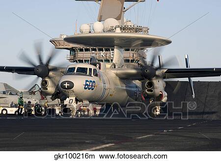 An E-2C Hawkeye during flight operations on USS Dwight D. Eisenhower. View Large Photo Image Picture - An E-2C Hawkeye during flight operations on USS Dwight D. Eisenhower.. Fotosearch