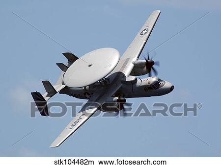 An E-2C Hawkeye executes a high performance fly-by during an Air Power Demonstration. View Large Photo Image Picture - An E-2C Hawkeye executes a high performance fly-by during an Air Power Demonstration.. Fotosearch
