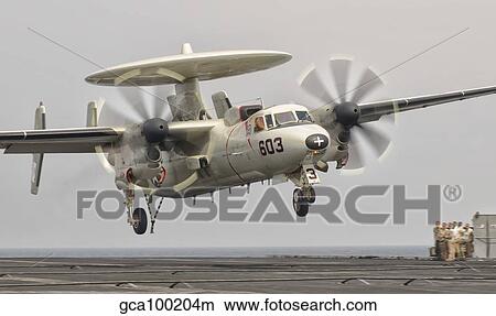 An E-2C Hawkeye landing on the flight deck of USS George H. W. Bush. View Large Photo Image Picture - An E-2C Hawkeye landing on the flight deck of USS George H. W. Bush.. Fotosearch
